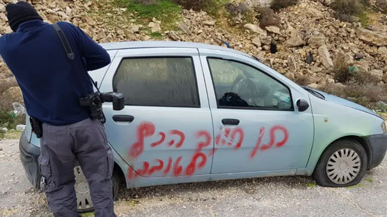 'Smile, it's all good' spray-painted on car
