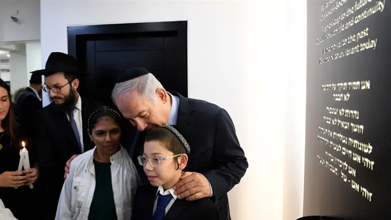 Moshe Holtzberg, son of murdered couple, and Netanyahu