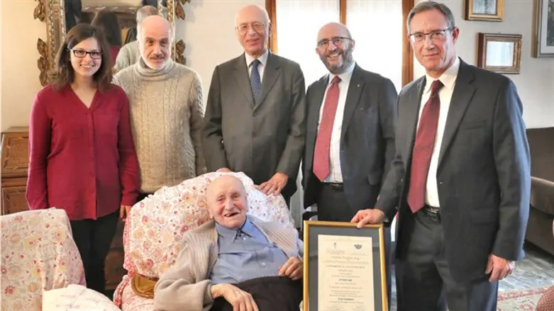Enzo Cavaglion (seated) with his granddaughter, son, and B'nei B'rith staff