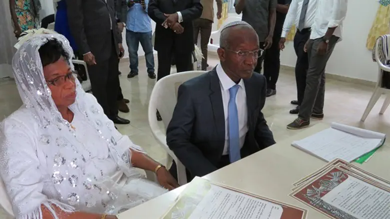 Avraham Yago and his wife with their new Jewish marriage certificates in Abidjan