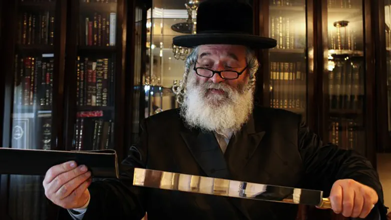 Kosher slaughter: Slaughterer checking knife