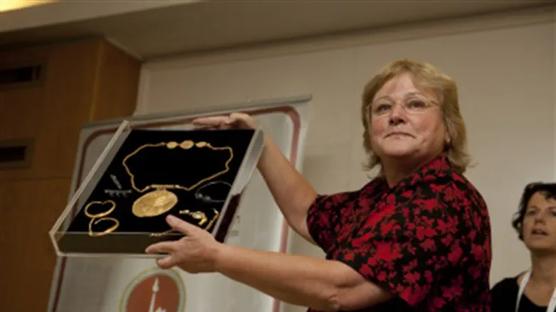 Dr. Mazar with an old golden medallion