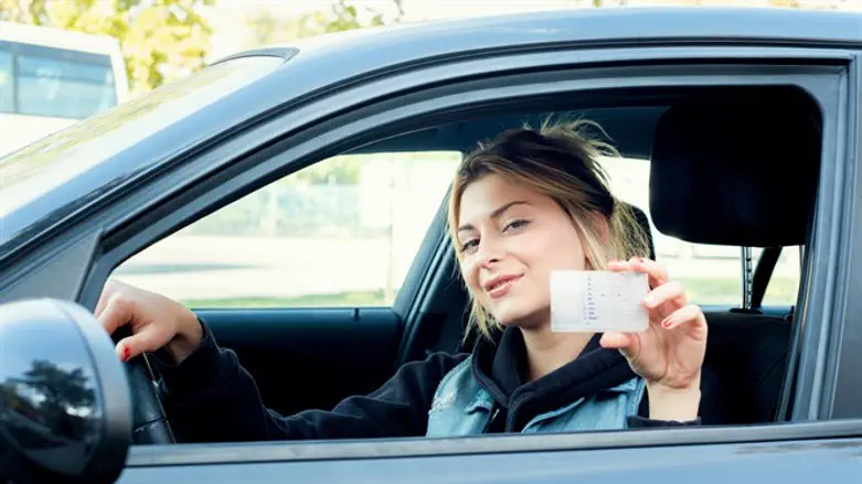 Woman showing drivers license