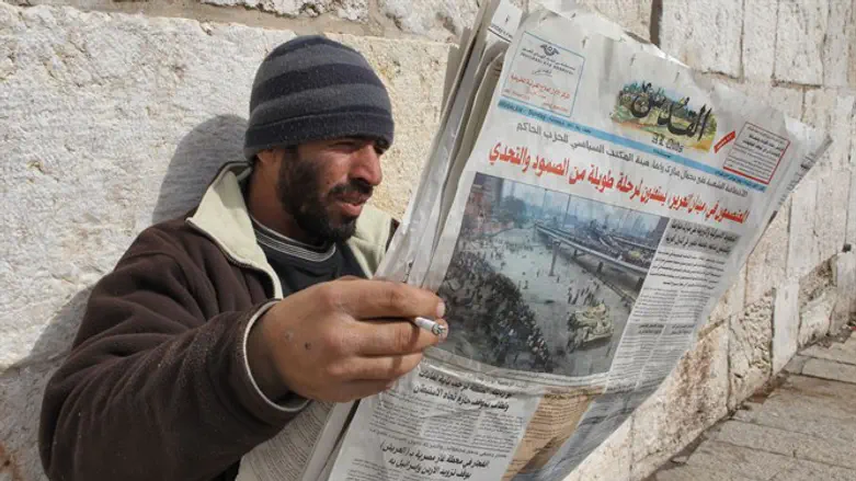 Arab reading newspaper, Old City, Jerusalem