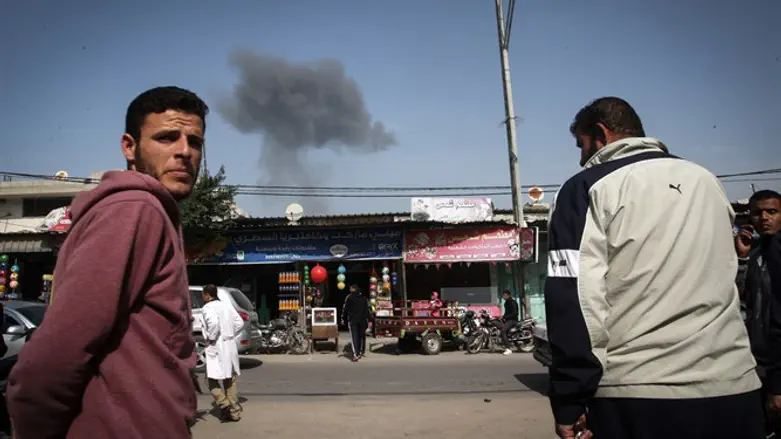Gazans watch smoke rise from building in Rafah