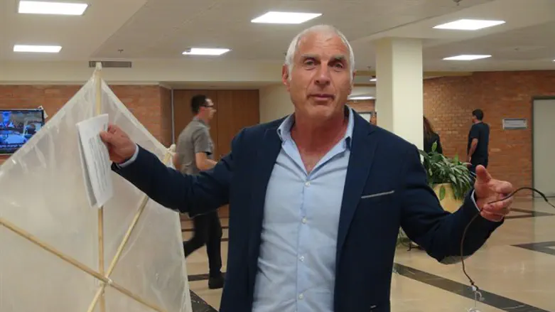 Haim Jelin holds an incendiary kite