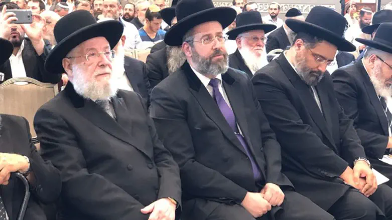 Rabbi Yisrael Meir Lau (left) and son