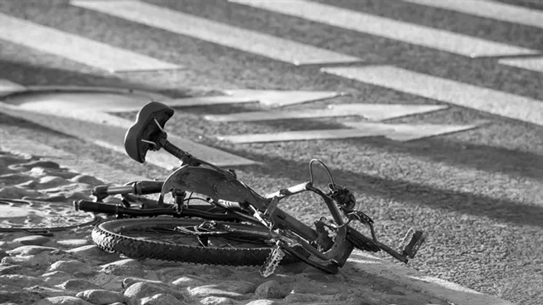 Crushed bicycle on road