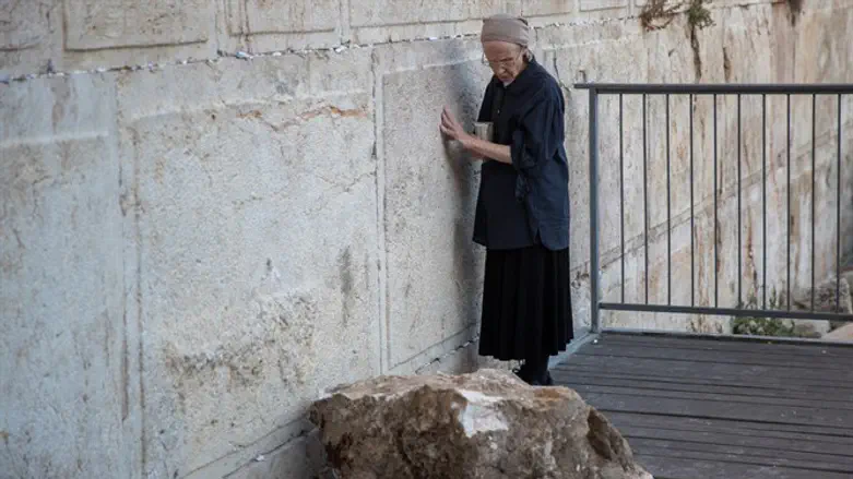 Daniella Goldberg next to stone that fell, missing her