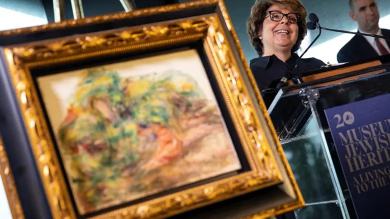 Sylvie Sulitzer next to the painting Deux Femmes Dans Un Jardin