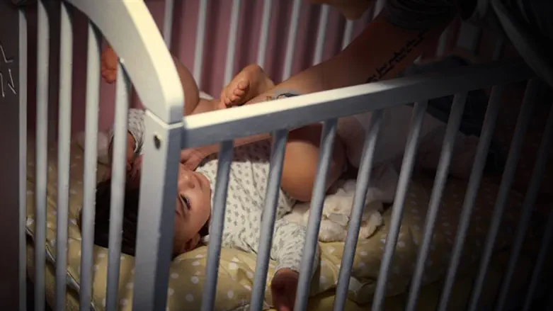 Baby in crib (illustrative)