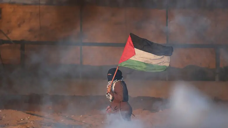 A terrorist near the fence in Gaza