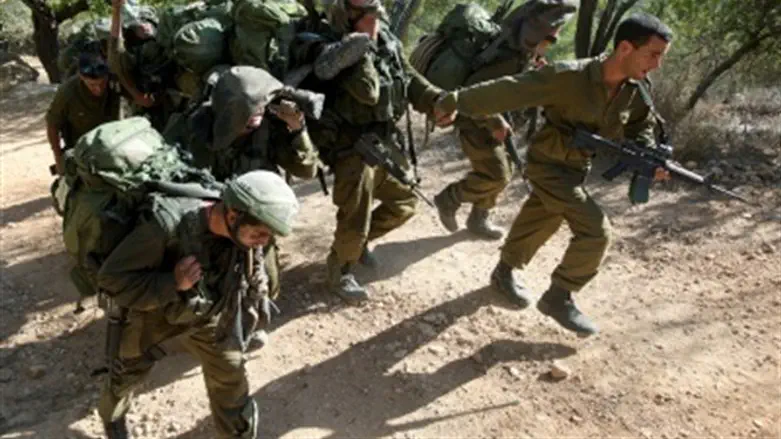 Soldiers carry stretcher in training.