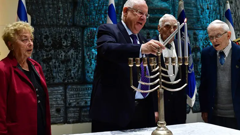 Rivlin lights Hanukkah candles with Holocaust survivors