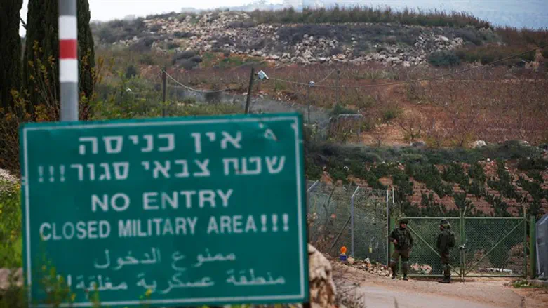 Israeli soldiers guard near border with Lebanon in town of Metulla