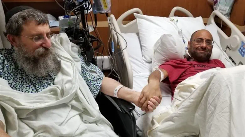 Rabbi Ephraim Simon, left, and recipient Adam Levitz