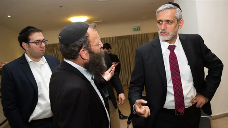 Otzma's Baruch Marzel (center-left) and Eli Yishai (right)