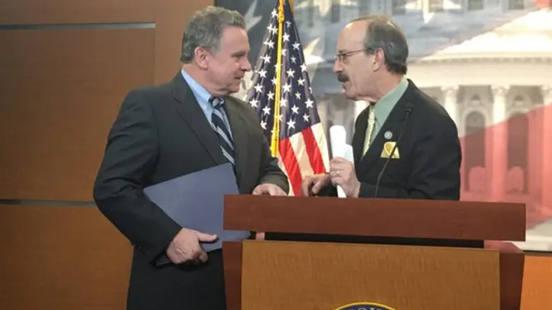 Rep. Chris Smith, R-N.J). left, and Rep. Eliot Engel, D-N.Y.,  in the Capitol