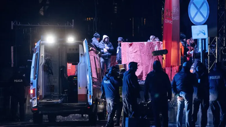 Emergency responders and police officers at scenf of Gdansk stabbing