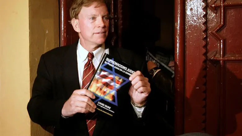 David Duke holds up Spanish translation of his book 'Jewish Supremacism'