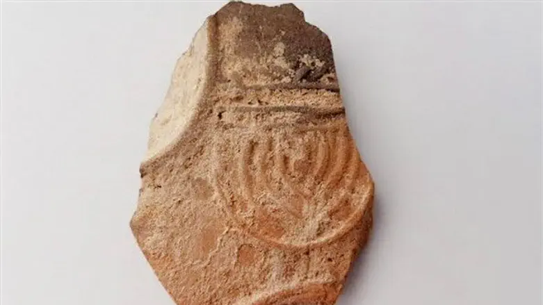sherd of lamp depicting menorah