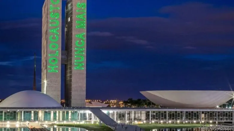 'Never Again' projected onto Brazilian congress buildings