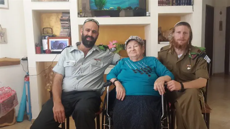 Yaffa Shaindy with two of her grandchildren.