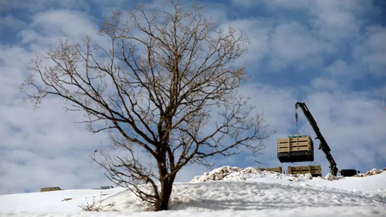 Crane lowers Iron Dome battery on Golan Heights