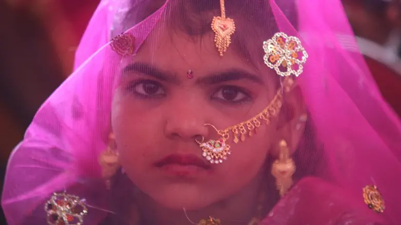 Young girl waits for her engagement ceremony to begin