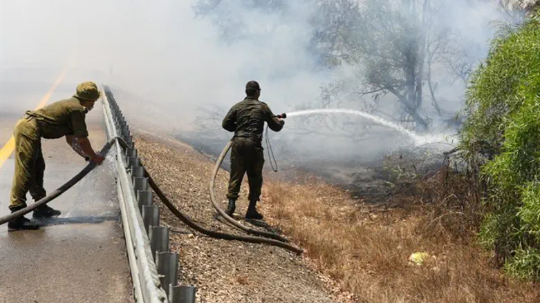 Firefighters extinguish arson fire