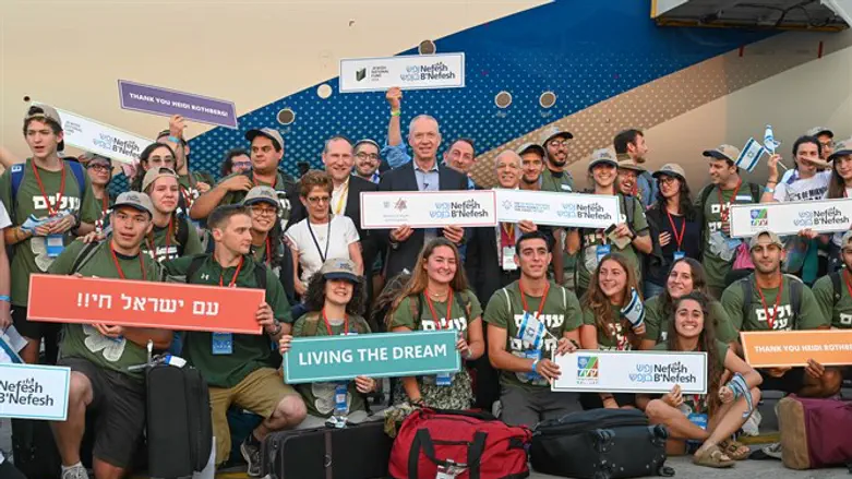 NBN's Rabbi Fass and Tony Gelbart, with Minister Galant and the future lone soldiers.