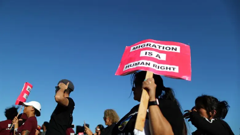 People protest outside the ICE immigration detention center in Adelanto