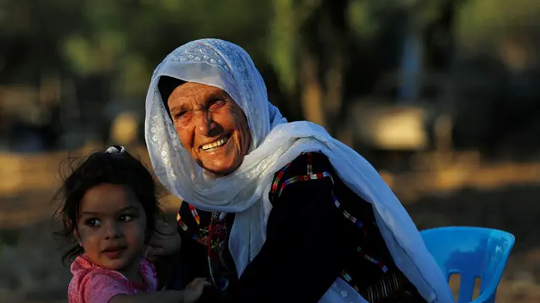 Muftia Tlaib with a grandchild 