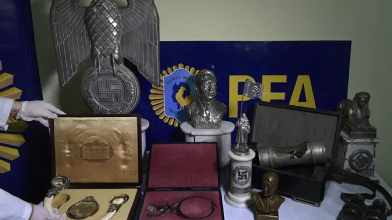 Argentina's Federal Police display some of the Nazi objects seized during a June