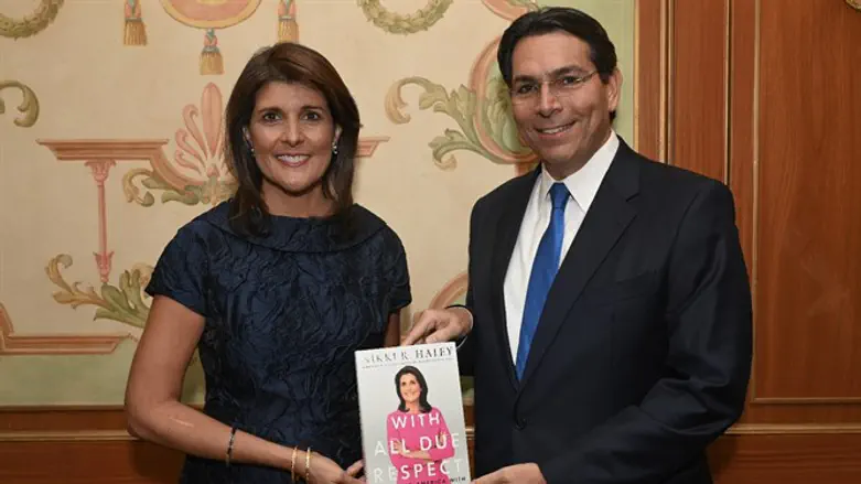 Nikki Haley presents Danny Danon with a copy of her book