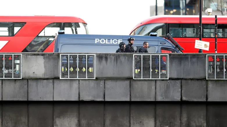 Police officers and emergency staff at site of incident at London Bridge