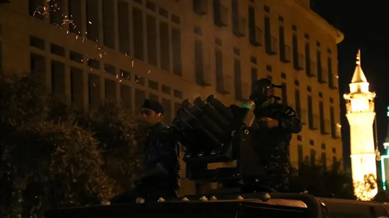 Riot police fire tear gas during anti government protests in Beirut