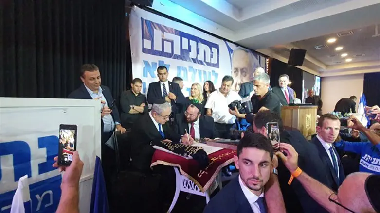Netanyahu writes in the Torah scroll