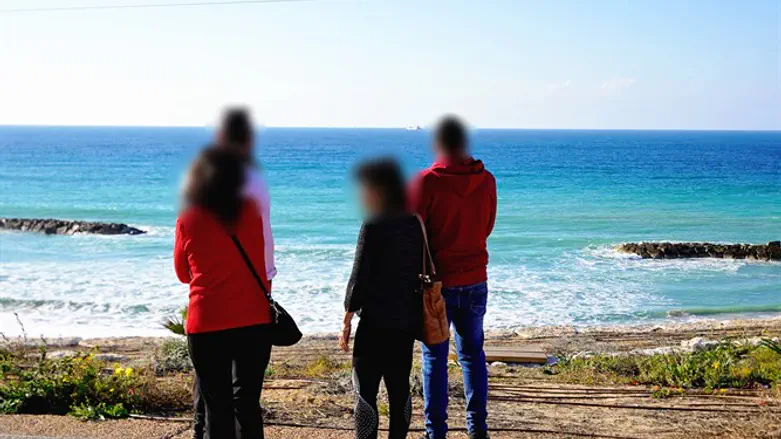 Muhammad and his mother walking along the Gaza-Israel border