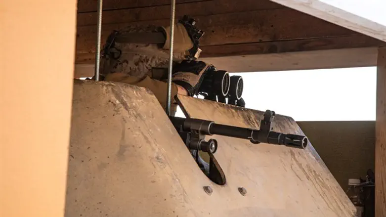 U.S. Marines keep watch at the U.S. Embassy in Baghdad