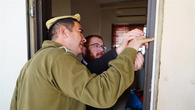 Placing one of the mezuzahs