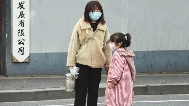 Woman and child wear masks to protect from coronavirus