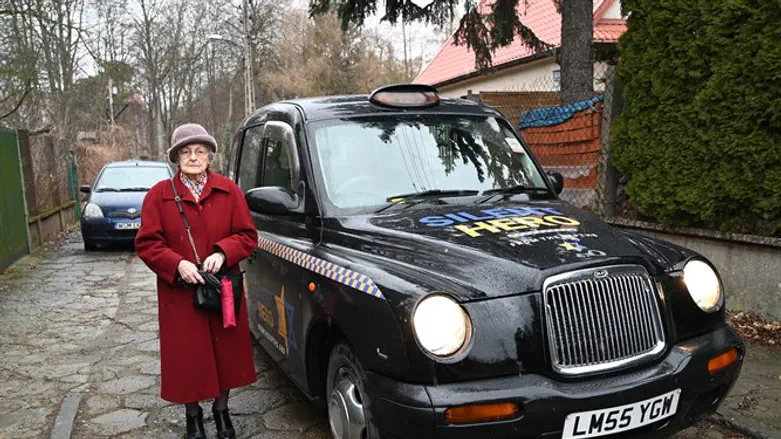 Anna Stupnicka-Bando gets set to enter one of the taxis for saviors of Jews
