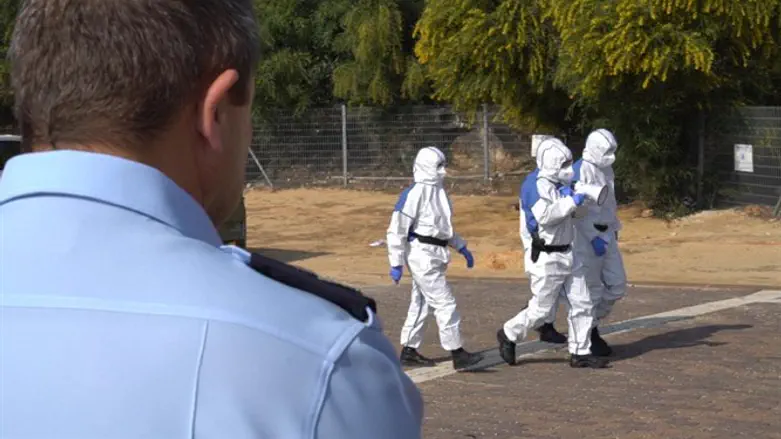 Police in protective suits