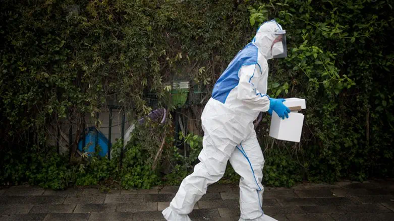 MDA medic dressed to check for coronavirus