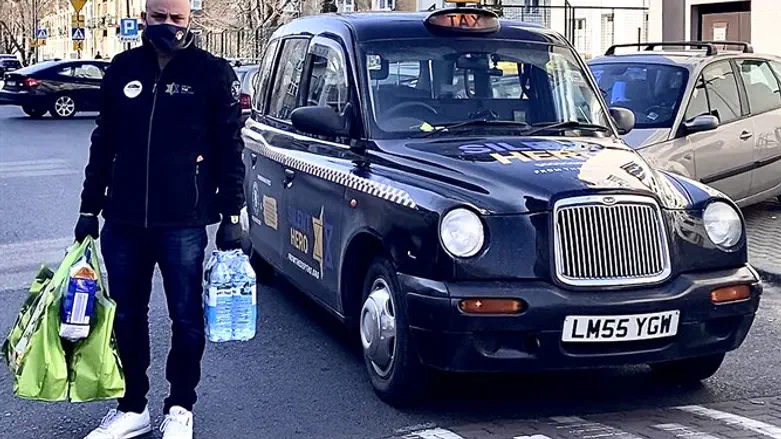 Jonny Daniels delivers groceries to a rescuer of Jews in Warsaw, Poland.