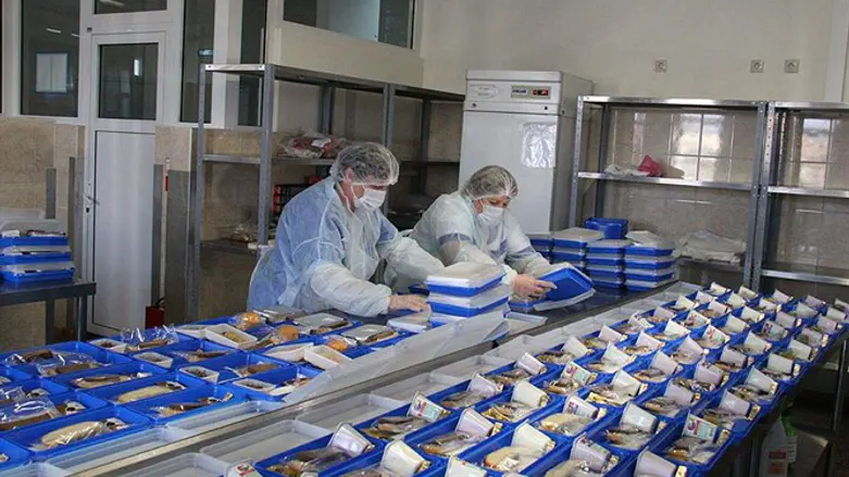 Employees of the Airports of Regions firm preparing meals for Russian over 65