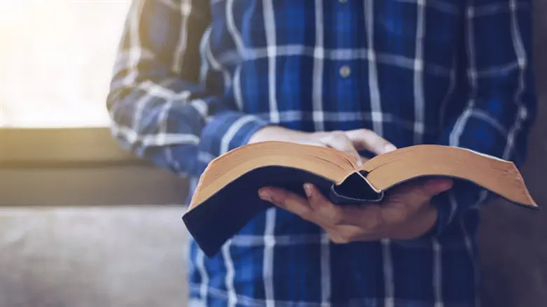 Man reading Bible (stock)
