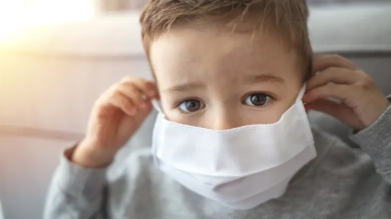 Child with a face mask