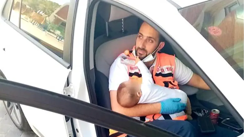 Ben David holding the baby